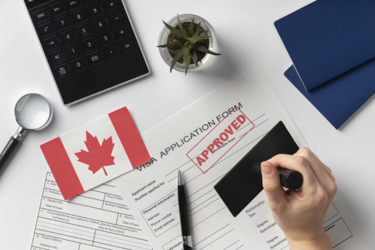 visa-application-composition-with-canadian-flag-scaled-1
